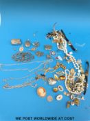 A hallmarked silver nurse's belt buckle together with other silver jewellery and costume items