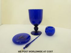 Four pieces of Bristol blue glass including Concorde paperweight,