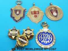 Three hallmarked 9ct gold football fobs including Southampton,