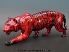 A large Royal Doulton flambe stalking tiger