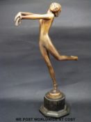 A Lorenzl patinated bronze Art Deco dancing girl, signed to base of figure,