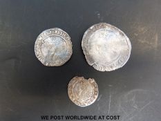 An Elizabeth I hammered sixpence together with a 1566 threepence and a 1561 penny.