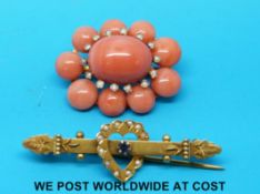 A brooch set with ten coral cabochons and seed pearls and a 9ct gold brooch set with seed pearls in