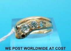 A Victorian ring set with three old mine cut diamonds with a blue hue in the form of a snake with