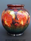 A Moorcroft flambe globular vase in the leaf and berry pattern (height 15cm)