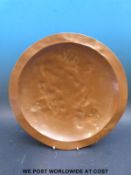 Birmingham Guild Arts & Crafts copper bowl with brass feet, diameter 35.