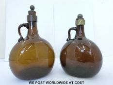 Two 19thC brown glass carafes,