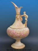 An exceptionally large Royal Worcester figural pedestal ewer decorated with pink flowers in a