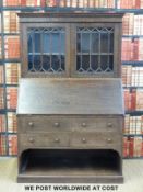 A astragal glazed bureau bookcase with cubbyhole beneath (width 107cm, depth 45cm,