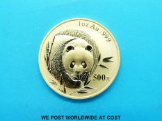 A cased Chinese panda bear gold coin, 31g,