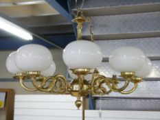 An eight branch brass chandelier light fitting (diameter approximately 74cm)