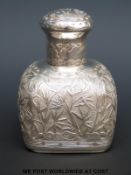 A Chinese white metal tea caddy with foliate decoration, height 11cm,