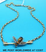 A 9ct gold necklace with a pendant depicting a bee formed of tiger's eye cabochons and old cut