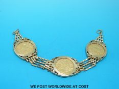 A 9ct gold bracelet set with three gold half sovereigns, one 1909, and two 1910 (23.