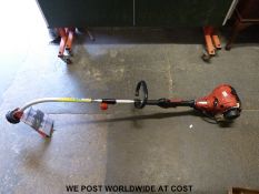 A Hecht 124R two-stroke petrol strimmer.