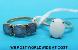 A 9ct gold ring set with three opal doublets and a 9ct gold ring set with an opal
