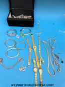 A collection of costume jewellery to include a bangle marked 375, silver bracelet, rings,