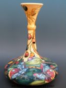 A Moorcroft ship's decanter shaped vase with tube lined decoration of butterflies and flowers dated