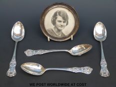 A hallmarked silver circular photograph frame,