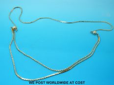 A 9ct gold flat link necklace with sphere decoration (24.