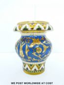 A Victorian hand painted amber glass vase, 15cm tall.