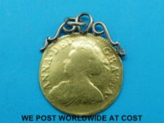 A 1713 gold Queen Anne half guinea