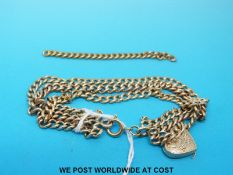 A three strand bracelet made up of a 9ct gold chain and two 18ct gold chains together with an 18ct