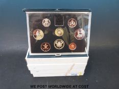 Four deluxe proof sets 1983-1986