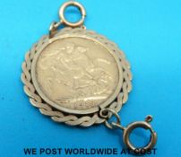 A 9ct gold mount set with a 1918 gold full sovereign (10.