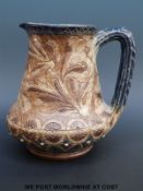 An early Martin Brothers incised pottery jug by Robert Wallace Martin.
