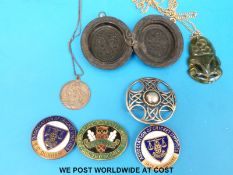 A hallmarked silver Celtic brooch, jade Tiki pendant,