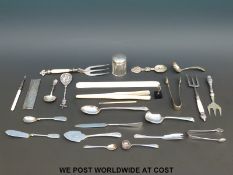 A white metal caddy spoon stamped 800 together with a similar comb stamped Denmark (298),