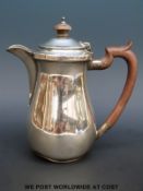 A hallmarked silver hot water jug,