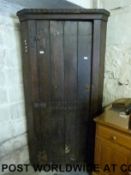 An oak corner cupboard/robe