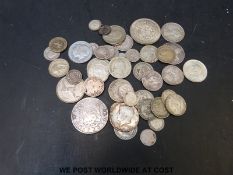 Approximately 290g of various UK and overseas predominantly silver coins,