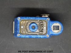 A 'Coronet Midget' miniature bakelite camera in rare mottled blue finish and with original leather