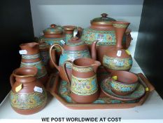 A collection of terracotta Prattware with enamelled effect decoration featuring griffins