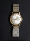 Garrard 9ct gold gentleman's automatic wristwatch with date aperture and gold hands,