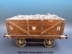 A Victorian oak cigar / cigarette box in the form of a South Western Railways coal wagon 1899,