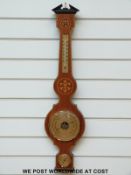 A banjo style barometer with inlaid decoration