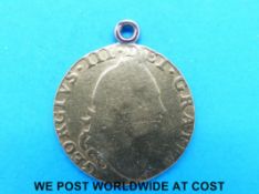 A 1786 half guinea fourth head, coat of arms reverse, mounted on loop (4.