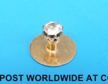 A yellow metal stud marked 15ct set with an old cut diamond