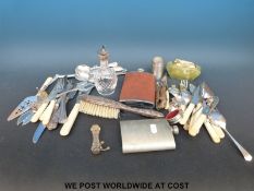 A quantity of metalware to include hallmarked silver backed brush, hallmarked silver handled knife,