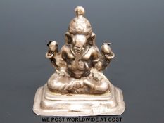 An Indian white metal model of Ganesh, marked to underside I 100,