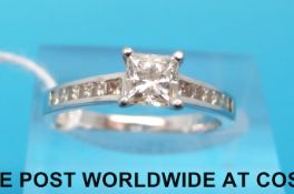 An 18ct white gold ring set with a princess cut diamond of approximately 0.
