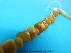An amber necklace consisting of irregular shaped beads,