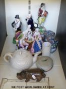 A collection of ceramics including a Belleek teapot, Staffordshire figures,