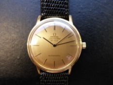 Omega Seamaster De Ville 18ct gold automatic wristwatch with black hands on gold face,