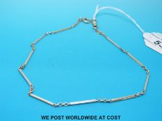 A 14ct gold sectional watch chain with ten reeded links, stamped London 1902 (35cm long - 9.