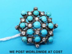 A yellow metal pendant/ brooch set with diamonds and turquoise